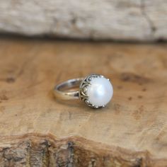 What a fun and elegant - Big Pearl Ring. With a stunning, creamy white, AAA mabe pearl at the center, our new Majestic Pearl Ring feels magic. The detailed sterling silver Gallery Wire Bezel against the big, lustrous, creamy white freshwater mabe pearl is perfect and unique - offering you a unique and different pearl ring. We only wish we had more of these AAA grade freshwater Mabe Pearls. Choose your size in the drop-down below - while they last. AAA, White Freshwater Pearl measures 12 - 12.5mm Big Pearl Ring, Silversmith Rings, Purple Amethyst Ring, Purple Rings, Freshwater Pearl Ring, Mabe Pearl, Big Pearl, Labradorite Earrings, Silver Tops