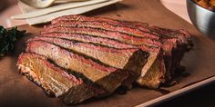 sliced up steak on a cutting board next to other foods