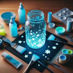 a jar filled with blue liquid sitting on top of a table next to other items