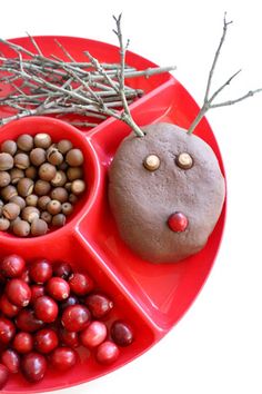 a red plate topped with chocolate reindeer play dough