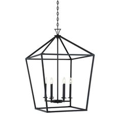 a hanging light fixture with four candles on it's sides and an iron frame