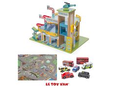 a toy town with cars and trucks on the street