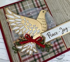 a close up of a card with a bird on it and the words peace joy