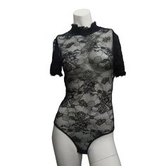 a woman's bodysuit with black lace on it