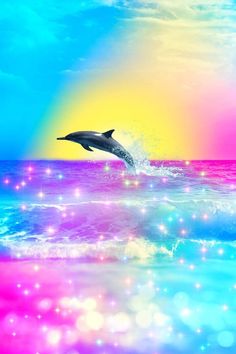 a dolphin jumping out of the water in front of a rainbow colored sky and clouds