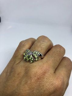 Rich and very bright Peridot green ring Sterling silver with rhodium finish Size 9 can be sized by my jeweler. His service charge is $10 All rings are shipped in a nice gift box. Check out our over a THOUSAND great reviews Engraving is $4 per letter and is not always perfect depending on the piece. It can take a few days if the jeweler is busy. This is payable to Paypal Judithsltd@gmail.com Lime Green Sterling Silver Rings As Gift, Lime Green Sterling Silver Rings For Gift, Peridot Rings In Lime Green As Gift, Green Multi-stone Rings For May Birthstone, Lime Green Peridot Rings For Gift, Lime Green Peridot Rings For Gifts, Sterling Silver Rings With Lime Green Accent Stones, Lime Green Sterling Silver Rings With Accent Stones, Green Multi-stone Ring For Gift