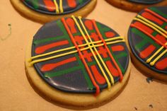 decorated cookies sitting on top of a table