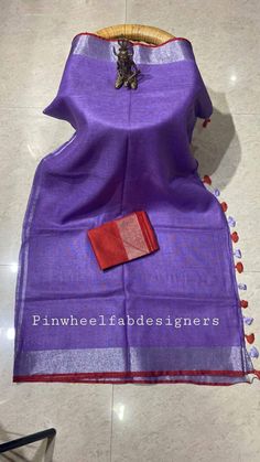 Linen sarees are always in demand.This handwoven purple linen saree give you a unique style.Linen sarees are breathable,light weight and easy to drape. Fabric: Linen by linen  Thread count:100 count Saree Color:purple Blouse piece:Red/ Running Occasion: Casual/Formal Saree length:5.50 mtr Blouse:80 cm Custom Stitching: Available upon request Saree Embroidery: Available upon request Blouse Stitching: Available upon request Shipping: 7 to 10 business days Note: Color may very slightly due to photo Linen Saree With Pallu, Festive Linen Saree With Pallu Detail, Festive Linen Saree With Zari Weaving, Festive Handloom Linen Saree, Festive Linen Handloom Saree, Traditional Linen Handloom Saree, Linen Dupatta For Festivals, Festive Handloom Linen Dupatta, Purple Slub Silk Handloom Dupatta