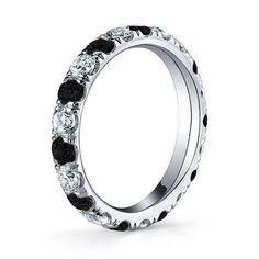 a wedding ring with black and white stones