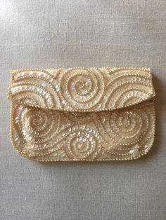 A personal favorite from my Etsy shop https://www.etsy.com/listing/550206837/vintage-faux-pearl-and-sequined-evening Embellished Cream Evening Bag, Embellished Cream Rectangular Clutch, Cream Embellished Rectangular Clutch, Cream Pouch Clutch For Evening, Formal Embellished Cream Clutch, Embellished Cream Evening Bag For Events, Cream Embellished Evening Bag For Events, Cream Beaded Party Clutch, Cream Beaded Clutch For Party