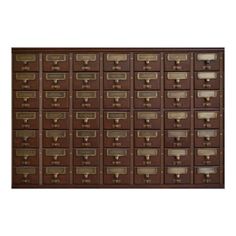 a large brown mailbox with many drawers on the front and side, all lined up in rows