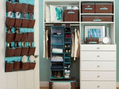 an organized closet with drawers and hanging storage baskets on the door, along with other items