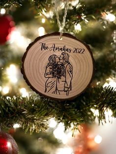 a wooden ornament hanging from a christmas tree