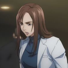 a woman with long brown hair wearing a white blazer and blue shirt is staring at the camera