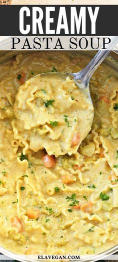 creamy pasta soup in a white bowl with a spoon