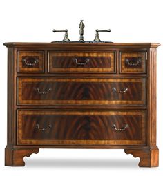 a wooden dresser with two sinks on it's top and one drawer below the sink