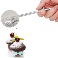 a person is sprinkling cherries on cupcakes with a grater