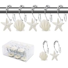 starfish and seashells hangers on a metal bar in front of a box