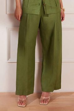 Moss green wide leg pleated trouser. - Aza Fashions Olive Wide Leg Pants For Spring, Green Relaxed Fit Wide Leg Pants, Chic Green Relaxed Fit Wide Leg Pants, Chic Green Relaxed Fit Bottoms, Chic Green Wide Leg Pants With Relaxed Fit, Elegant Green Wide Leg Pants, Olive Pants For Summer Workwear, Elegant Green Wide Leg Pants With Pockets, Green Wide-leg Workwear Bottoms