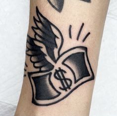 a black and white photo of a tattoo with an eagle on it's arm