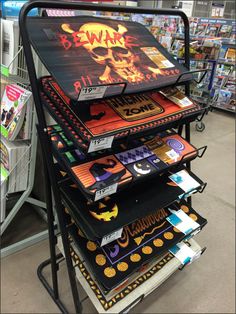 a display in a store filled with lots of halloween themed items and signs on it