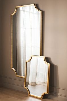 The Joslyn Mirror, framed in gilded gold, radiates opulence and refinement, instantly elevating the aesthetic appeal of any space with its luxurious touch. | Joslyn Mirror by Anthropologie in Gold, Size: Medium Luxury Mirror Wall, Long Mirror, Leather Mirror, Floral Mirror, Anthropologie Home, Rattan Mirror, Arched Mirror, Vintage Mirrors, Candles For Sale