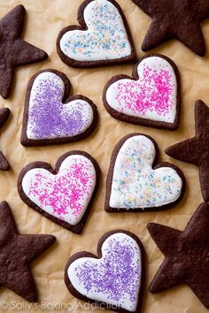 decorated cookies arranged in the shape of hearts and stars