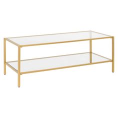 a gold coffee table with glass shelves on the top and bottom, against a white background