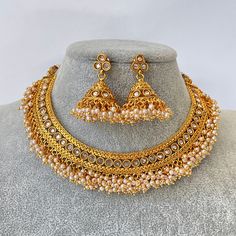 Gold Polki Kundan necklace South Indian Jewelry Temple Jewelry Guttapusalu Necklace Wedding necklace Bridal necklace Indian necklace This is 100% Handmade jewelry. So the color, shades, and texture displayed may vary slightly from the actual product due to digital image limitations. We request you consider these minor variations. Please expect the possibility of some slight imperfections when buying handmade jewelry. If you have any questions, please message or email us. Arrives in a gift box. P Heavy Temple Necklace With Round Beads For Wedding, Bridal Necklace With Latkans For Festivals, Round Bridal Necklace With Latkans For Festivals, Heavy Bridal Necklace With Round Beads For Diwali, Wedding Jewelry With Round Beads For Navratri, Pearl Necklace For Wedding And Diwali, White Bollywood Bridal Necklace For Navratri, Bollywood Style White Bridal Necklace For Navratri, Festive Pearl Necklace With Latkans For Wedding