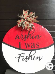 a wooden sign that says, wishin'i was fishin'on it