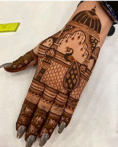 a henna design on someone's hand