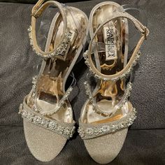 Like New Condition Badgley Mischka Crystal Strap Heels. Three Gorgeous Set Crystal Straps And Gold/Rose Gold Accents. Size 8 1/2, Unused. No Visible Flaws. Sparkling Silver Ankle Strap Wedding Shoes, Silver Sparkling Ankle Strap Wedding Shoes, Champagne Glitter Heels For Formal Occasions, Silver Glitter Heels For Wedding, Champagne Embellished Heels For Cocktail, Elegant Silver Wedding Shoes With Bling, Silver Glitter Open Toe Wedding Shoes, Glamorous Silver Wedding Shoes With 4-inch Heel, Silver Embellished Wedding Shoes For Gala