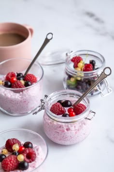 three desserts on a white plate topped with berries