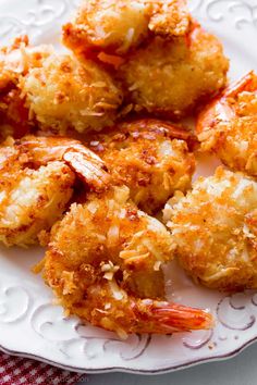 fried shrimp is served on a white plate