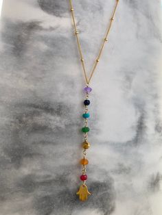 These dainty gemstone Chakra necklace is designed with seven different gemstones, each symbolizing the seven energy points in your boyd. Each of the gemstones has its healing powers and is believed to render physical, mental, and spiritual benefits. From bottom to top, this strand includes Ruby, carnelian, pyrite, emerald, turquoise, lapis lazuli and amethyst. ---------------------------------------- + How to Make Your Necklace + Choose your Chain: - SATELLITE CHAIN: 1. 18K Rose gold over 925 st Adjustable Rainbow Spiritual Necklace, Spiritual Crystal Necklace With Adjustable Chain And Dangle, Bohemian Birthstone Crystal Necklace For Healing, Multicolor Wire Wrapped Spiritual Necklace, Bohemian Rainbow Necklace Gift, Multicolor Spiritual Necklace With Adjustable Chain, Spiritual Rainbow Crystal Gemstone Necklaces, Multicolor Spiritual Necklaces With Adjustable Chain, Spiritual Multicolor Necklace With Adjustable Chain