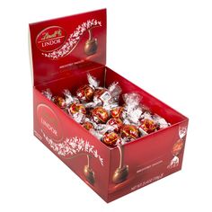 a red box filled with chocolate covered candies