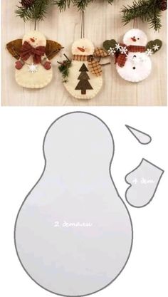 christmas decorations are hanging on the wall next to a cut out snowman and tree