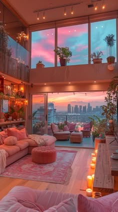 a living room filled with lots of furniture next to tall windows covered in pink curtains