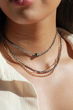 "Flaunting a colorful pearlescent finish, the peacock pearls strung along to this adjustable beaded necklace have been emphasized with gold-filled accents for a sizzling tropical twist. ✦ DETAILS ✦ ✧ Name: Maile (MIE-leh) - vine. ✧ Adjustable Length from: 15\"-17\" Inches. ✧ Black/Peacock 2-3mm Freshwater Pearls. ✧ 14kt Gold Filled Components, Extender, and Clasp. ✧ All Ke Aloha Jewelry pieces come packaged thoughtfully, beautifully, and ready for gift giving. ✦ MORE GOLD NECKLACES ➤ http://www. Gold Tahitian Pearl Necklace, Gold Necklace With Tahitian Pearl Round Beads, Gold Tahitian Pearl Single Strand Necklace, Gold Tahitian Pearl Necklace With Pearl Charm, Hawaii Necklace, Black Peacock, Peacock Pearls, Peacock Pearl, Gemstone Hoop Earrings