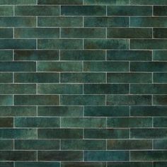 a dark green brick wall that has been painted in different shades and sizes, as well as the colors of the tiles