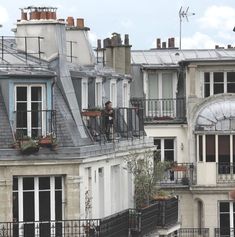 an apartment building with lots of windows and balconies