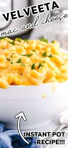 a bowl filled with macaroni and cheese on top of a table