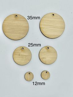 four wooden circles are shown with measurements for each one, and the other is about to be cut into smaller pieces