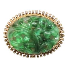 This is part of Chairish’s Costume Jewelry assortment.  1960s oval goldtone carved faux-jade brooch with security clasp. Marked "Napier." Measures: 1 1/8 inches long by 1 7/16 inches wide. Excellent condition. Jade Brooch, Carved Jade, Fun Jewelry, Jade Carving, Vintage 1960s, Amazing Jewelry, Costume Jewelry, Brooches, Vintage Jewelry