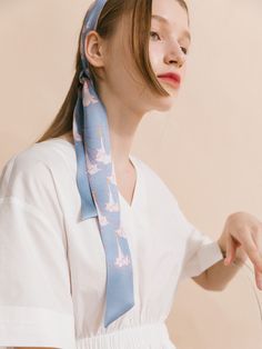 Elevate your wardrobe with the captivating beauty of our "Dadura" silk twilly skinny scarf, a stunning accessory inspired by the delicate blooms of the darling darura flower, also known as angel's trumpet. The design embodies the voice of nature, immersing you in its ethereal beauty and transporting you to a realm of tranquility and peace. Made from premium quality silk satin, this skinny scarf is perfect for a hair scarf style. It can also drape elegantly around your neck, immersing you in its Summer Silk Scarf With Ties, Trendy Scarves With Ties For Spring, Elegant Blue Silk Scarf For Spring, Trendy Spring Scarves With Ties, Spring Blue Floral Print Silk Scarf, Chic Blue Silk Scarf For Spring, Chic Blue Silk Scarf As Gift, Elegant Summer Scarf With Ties, Chic Blue Scarves For Gifts