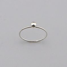 Sterling Modernist Ball Ring, Minimalist Sterling Ring, Silver charm Ball Ring Jewelry CODE: PLSRG92 Material: 925 Sterling Silver Finishing: silver Weight: 0.72 gram Ring size: 6,7,8 available Price per piece Minimalist Sterling Silver Ball Ring for Everyday Elegance" its made by hand This understated silver ring features a smooth, spherical design--a true embodiment of simplicity and timeless style. Crafted from 925 sterling silver, it's perfect for those who appreciate effortless elegance.  H Nickel-free Silver Minimalist Stackable Rings, Elegant Nickel-free Sterling Silver Midi Rings, Minimalist Nickel-free Silver Stackable Rings, Tiny Silver Sterling Stackable Rings, Tiny Silver Stackable Sterling Silver Rings, Simple Sterling Silver Stackable Midi Rings, Adjustable Sterling Silver Stackable Rings With Simple Design, Sterling Silver Midi Promise Ring With Simple Design, Sterling Silver Simple Design Midi Promise Ring