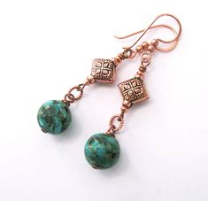 These mosaic turquoise boho style earrings feature large 12mm (1/2 inch) beads dangling from beautiful, handmade diamond shape artisan copper beads and copper hooks. Mosaic turquoise is an assembled stone made up of turquoise gemstone with other stones in colors of blue turquoise, green, tan and brown to near black in random patterns. I've wire-wrapped them with darkened copper headpins to little circle connectors with a twist design, then suspended them from the diamond shape bead station. The Spiritual Jewelry With Round Beads And Matching Earrings, Turquoise Teardrop Jewelry For Crafting, Turquoise Round Beads Earrings For Gift, Bohemian Turquoise Beaded Round Earrings, Copper Jewelry With Matching Round Bead Earrings, Turquoise Beaded Copper Earrings, Southwestern Jewelry With Round Beads For Pierced Ears, Nickel-free Turquoise Jewelry For Crafting, Bohemian Turquoise Jewelry With Matching Earrings