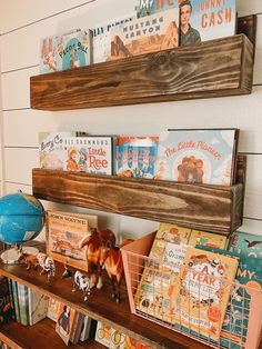 two wooden shelves filled with books and toys