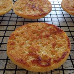 several small cakes cooling on a wire rack