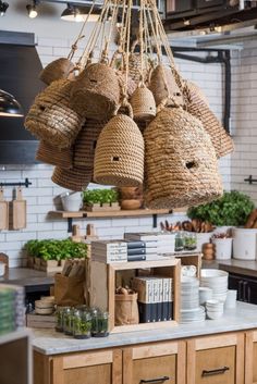 baskets hanging from the ceiling in a kitchen